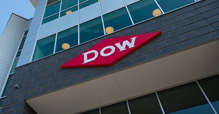The Dow diamond hanging on the entrance to an office building
