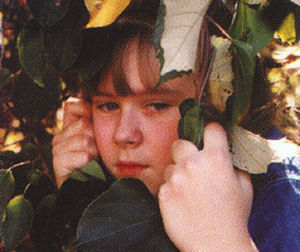 child with leaves